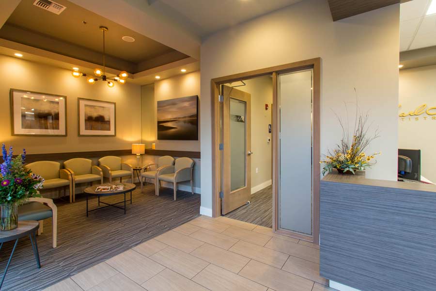 Entryway with lobby and reception desk at Karl Hoffman Dentistry in Lacey, WA