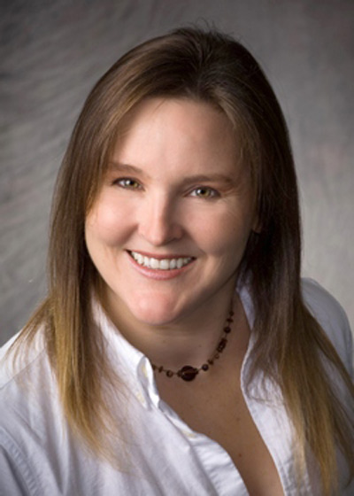 Woman with necklace smiling, a patient at Karl Hoffman Dentistry in Lacey, WA