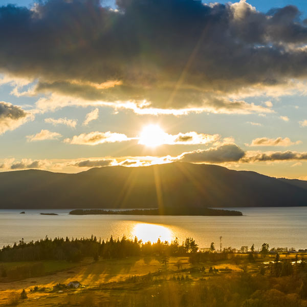 Sunshine over hills and water in the Puget Sound.